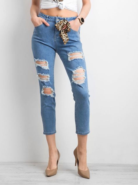 Damskie spodnie jeansowe z dziurami niebieskie